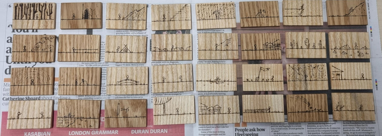 Finished pyrographed tiles.