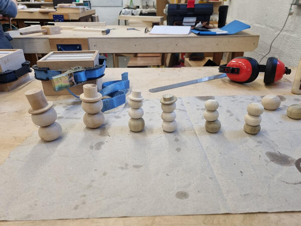 Wood turned snowmen.